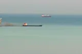 Cinci marinari salvați de pe nava care a luat foc, externați