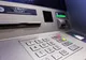 Persoane bănuite de skimming, depistate în flagrant delict la un ATM din Turnu Severin